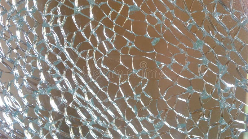 Shattered safety glass with blue and beige. Shattered safety glass with blue and beige