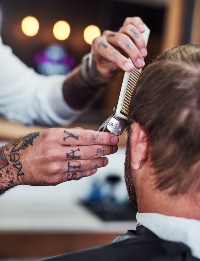 We style your hair exactly how you like it. an unrecognizable men getting a haircut at a barbershop. We style your hair exactly how you like it. an unrecognizable men getting a haircut at a barbershop