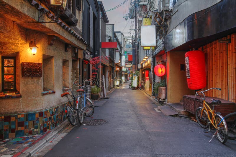 A charming and typical narrow street in the Pontocho area of downtown Kyoto, Japan at dusk. A charming and typical narrow street in the Pontocho area of downtown Kyoto, Japan at dusk.