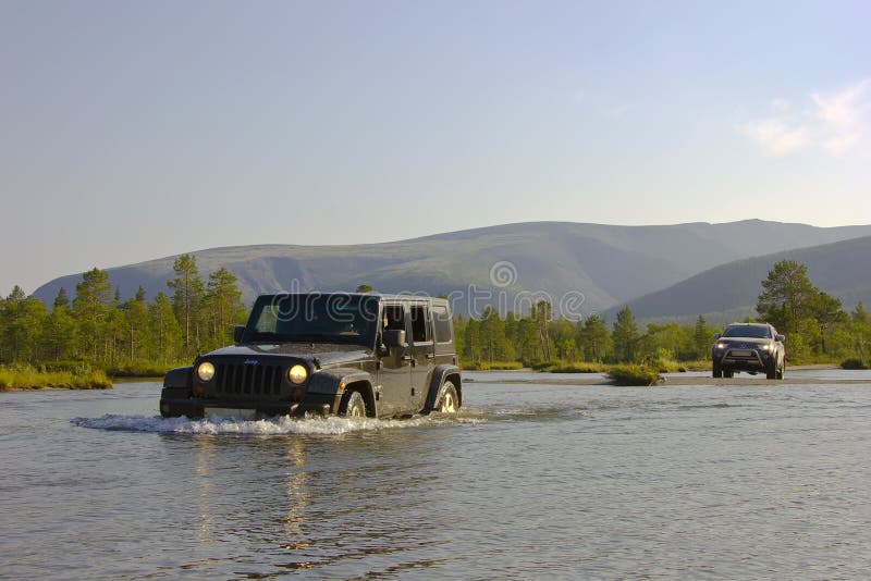 The journey by car jeep wrangler , riding in the SUV, travel to Russia, Northern nature, lake in the hills. The journey by car jeep wrangler , riding in the SUV, travel to Russia, Northern nature, lake in the hills