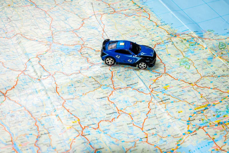 Traveling and navigate with a good old paper road map in your car to your destination. Traveling and navigate with a good old paper road map in your car to your destination