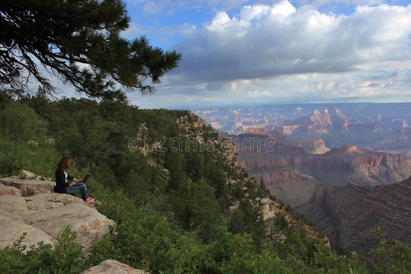 Journey to America, telework, freelance work, work online, work at the computer, the Grand Canyon, the girl against the backdrop of the Grand - Canyon. Journey to America, telework, freelance work, work online, work at the computer, the Grand Canyon, the girl against the backdrop of the Grand - Canyon