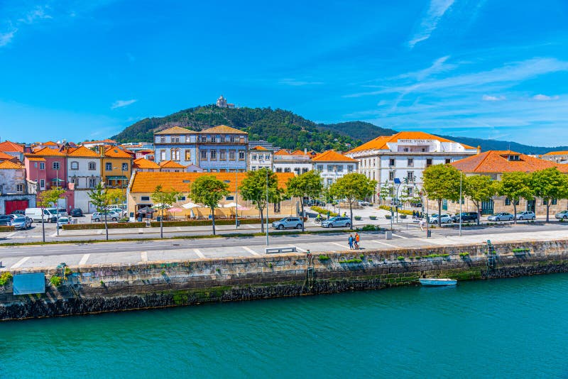 VIANA DO CASTELO, PORTUGAL, MAY 24, 2019: Colorful facades of houses on Lima riverside in Viana do Castelo in Portugal