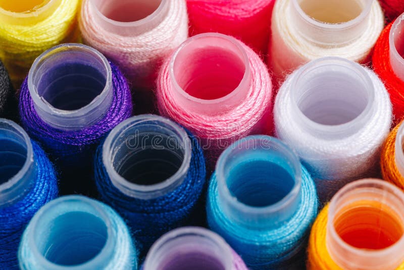 A Vibrant Arrangement of Colorful Thread Spools Perfect for Sewing, Crafting, and Quilting Projects royalty free stock photos