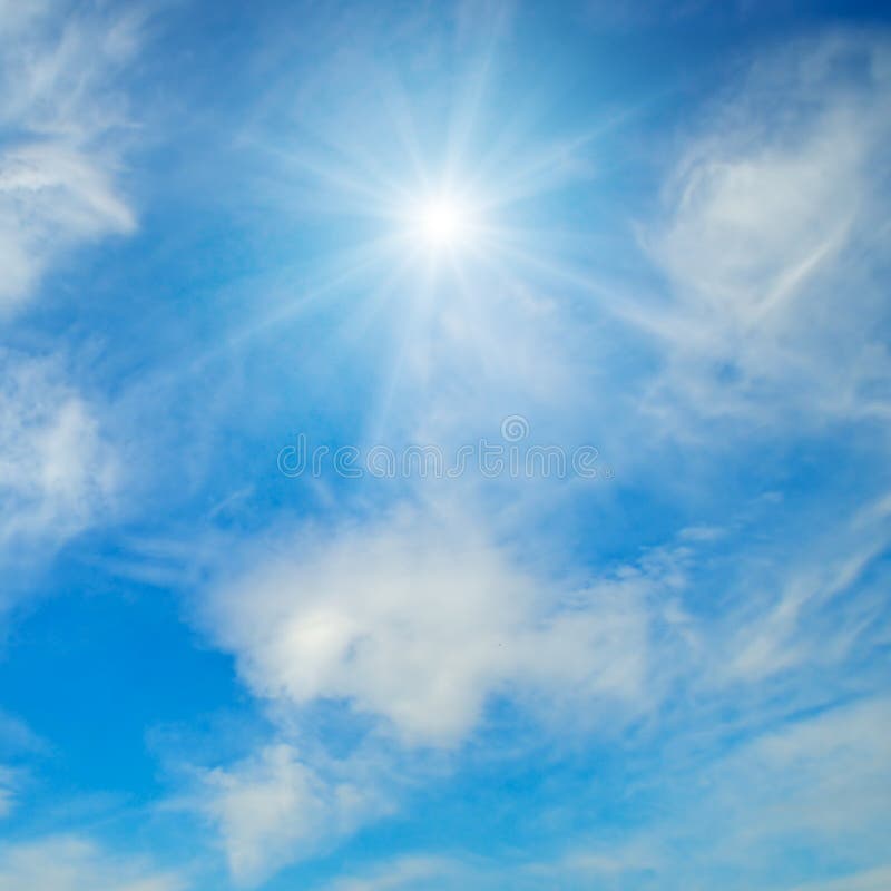 Sun with Rays in a Blue Sky with Clouds stock photography
