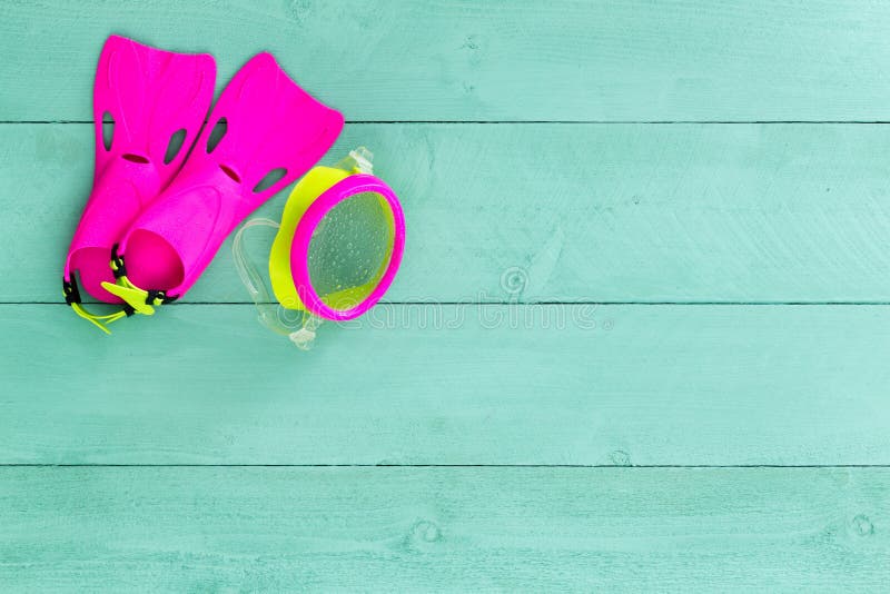 Vibrant colorful kids goggles and flippers stock photos
