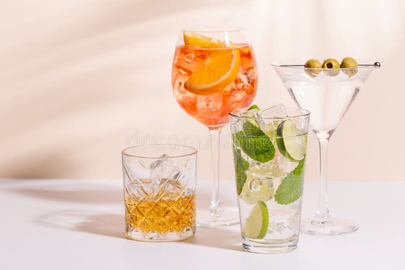 A vibrant display of cocktails, including Aperol Spritz, Mojito, and Martini royalty free stock image