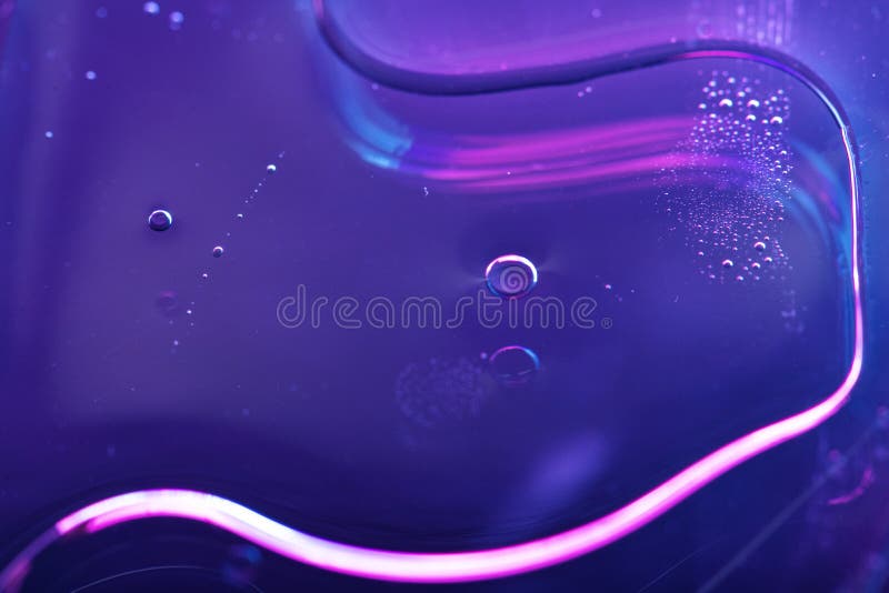 Vibrant neon purple liquid background stock photography
