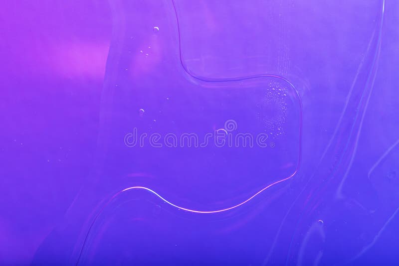 Vibrant neon purple liquid background stock image