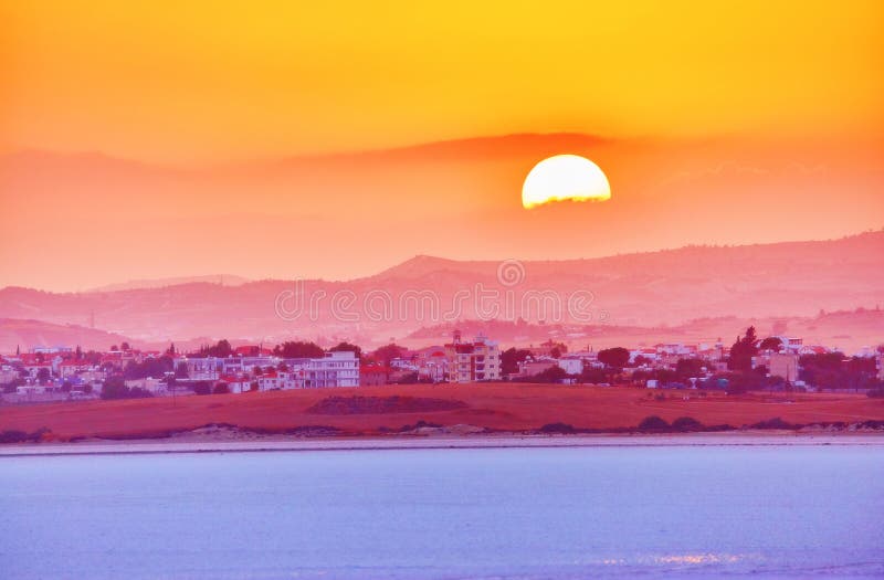 Vibrant and soften view of nice sunset over dry salt lake in Cyprus Larnaca in summer