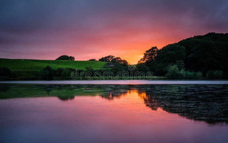 Vibrant sunset over lake