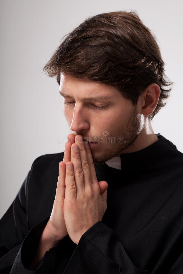 Vicar praying earnestly stock image. Image of hands, clergy 36573707