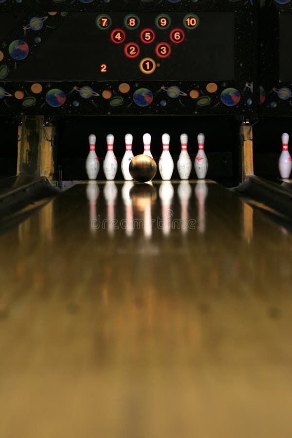 A bowling ball just before striking the pins. A bowling ball just before striking the pins.