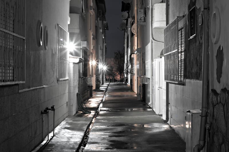 Dark empty back alleyway after the rain. Dark empty back alleyway after the rain