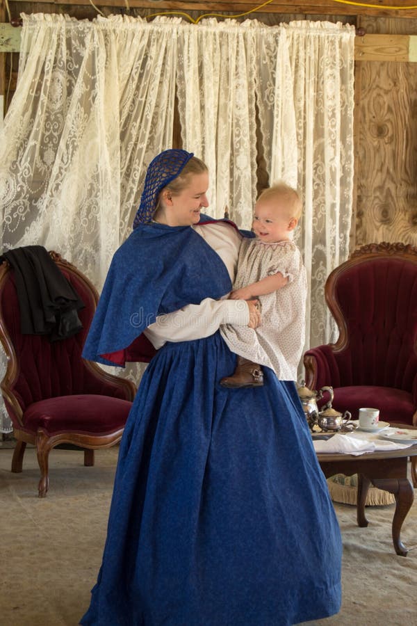 Buchanan, VA - April 26: Woman and child in dressed in Civil War period clothing in a Victorian Fashion Show at the Buchanan Civil War History Weekend on April 26, 2014, Buchanan, Virginia, USA.