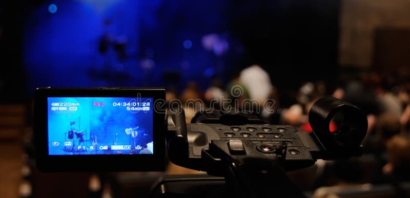 Digital video camera shooting a rock concert
