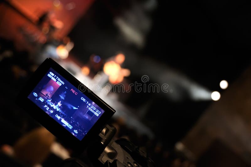 Digital video camera shooting a rock concert