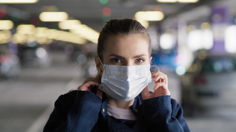 Handheld video woman putting a protective face mask.