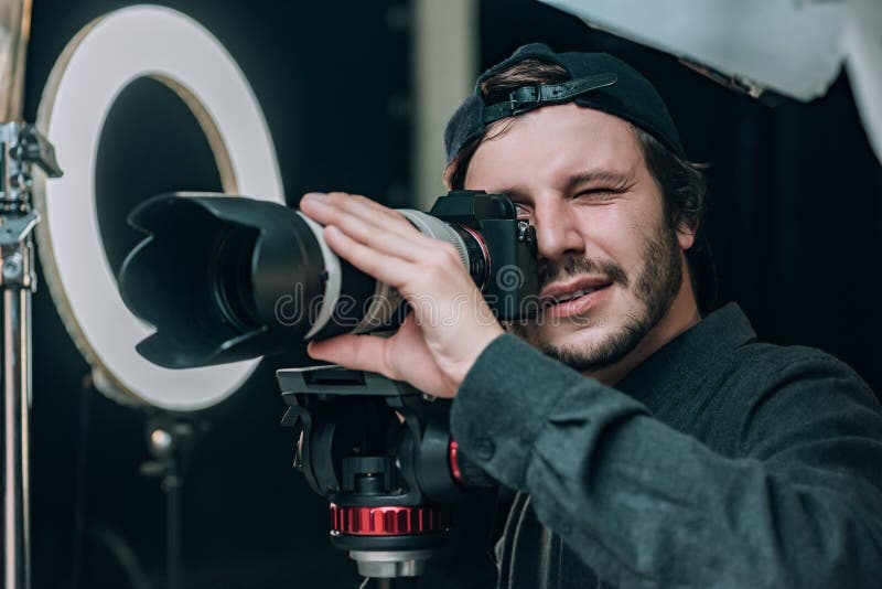 Videographer Looking in Camera Viewfinder Stock Image Image of