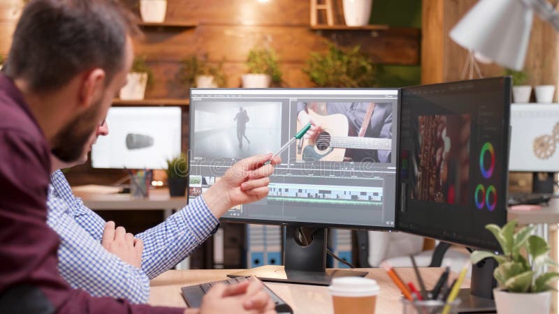 Videographer producer editing film production discussing movie graphic stock photo