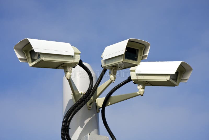 Security cctv cameras in front of blue sky. Security cctv cameras in front of blue sky