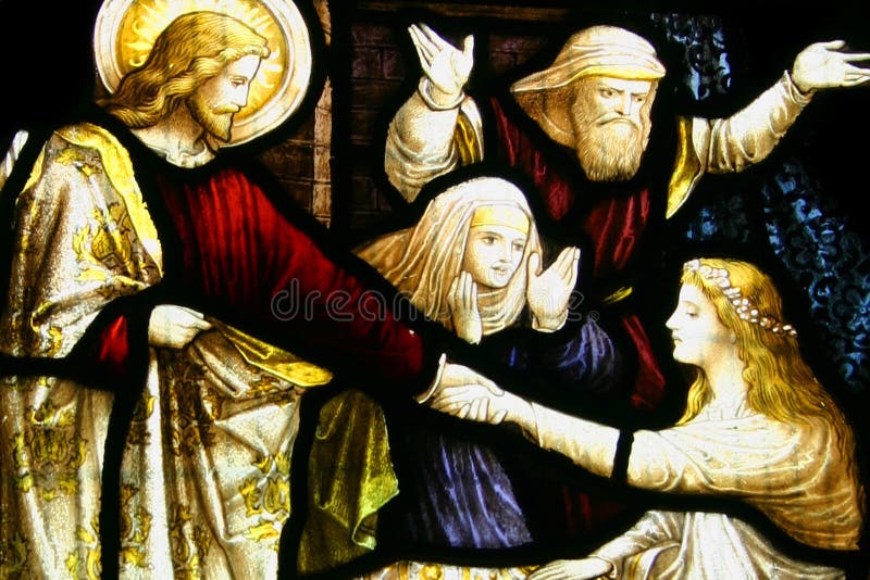 Vidrio manchado, Cristo que cría al niño foto de archivo