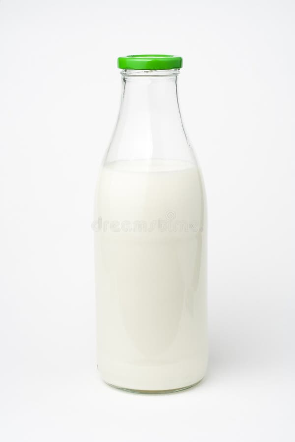 Pouring fresh glass of milk isolated over white. Pouring fresh glass of milk isolated over white