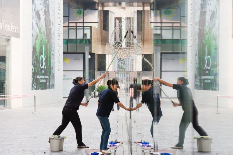 Cleaner cleaning glass of buildings, Beijing,China. Cleaner cleaning glass of buildings, Beijing,China