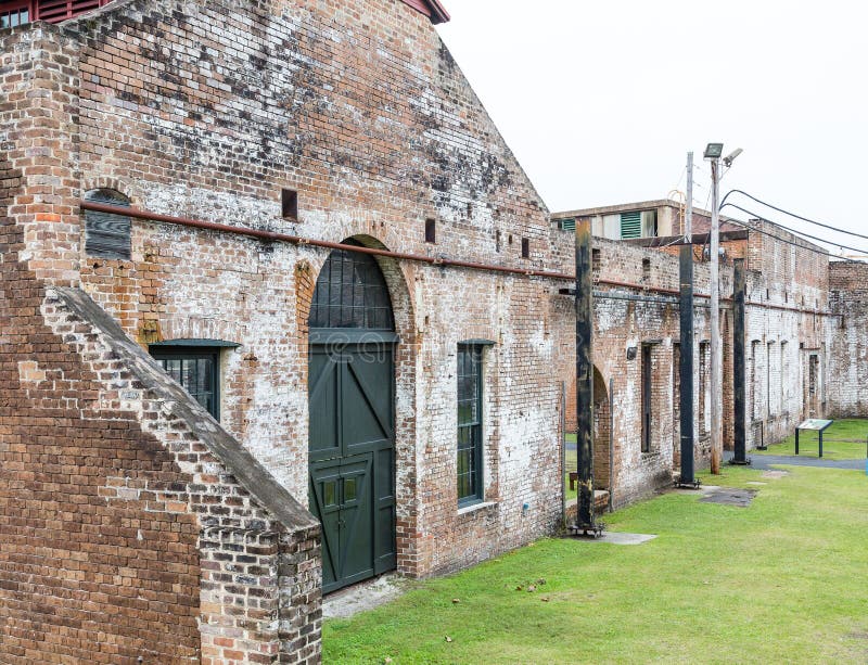 Old Brick Warehouse with Green Door in Savannah Train Yard. Old Brick Warehouse with Green Door in Savannah Train Yard