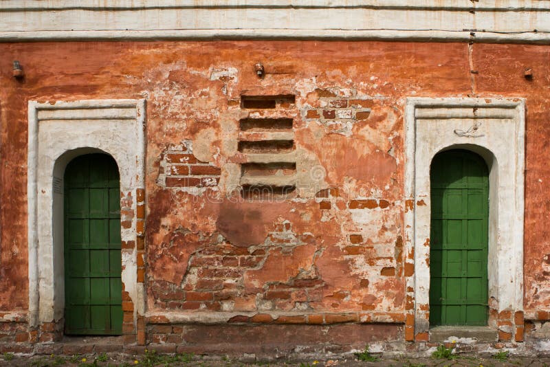 Old green door of red brick building. Old green door of red brick building