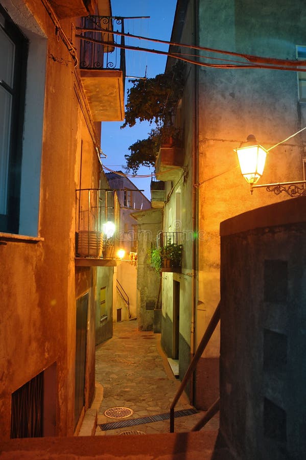 Typical narrow alley of a small and old town in south Italy, Calabria region. Typical narrow alley of a small and old town in south Italy, Calabria region.