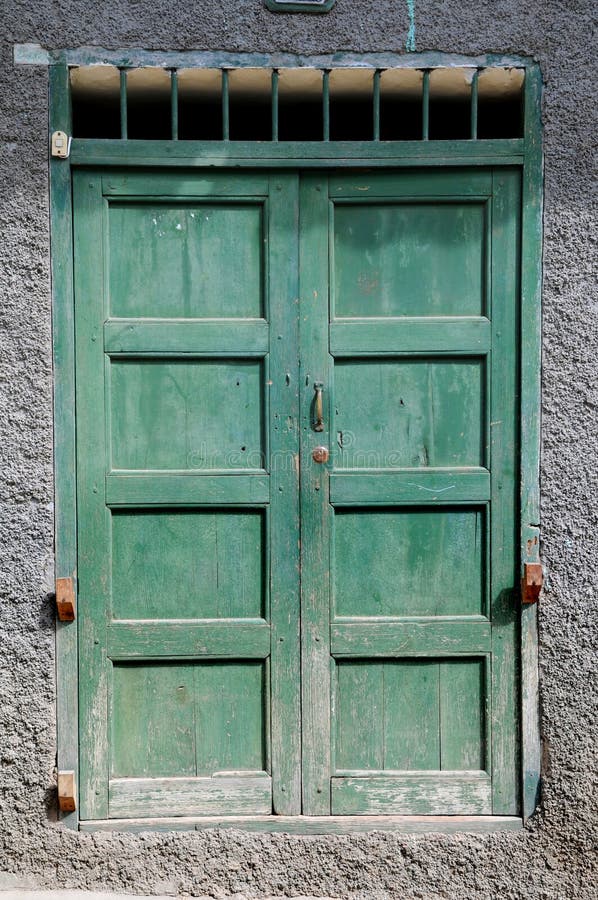 Old grunge green door with paint chipping. Old grunge green door with paint chipping