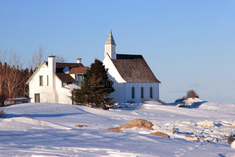 Old rural church photographed in winter in Port-Au-Persil in the Charlevoix region in Quebec, Canada. Old rural church photographed in winter in Port-Au-Persil in the Charlevoix region in Quebec, Canada.