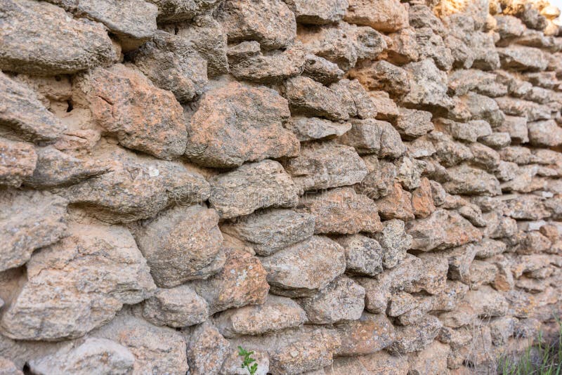 Viejo fondo de la pared de piedra E imagenes de archivo Viejo fondo de la pared de piedra E imagenes de archivo