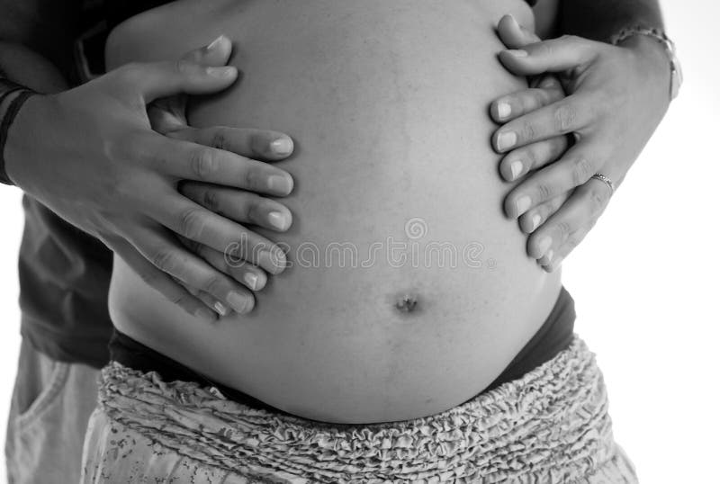 Vientre de Pregant con las manos imagen de archivo Vientre de Pregant con las manos imagen de archivo