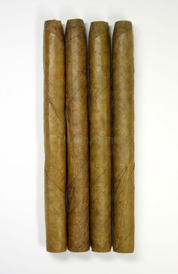 Four cigars close-up from the top on a white background. Four cigars close-up from the top on a white background