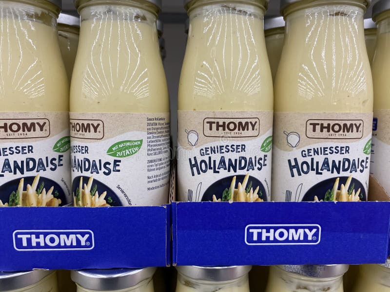 Closeup of Sauce Hollondaise Bottles with Thomy Logo Lettering in