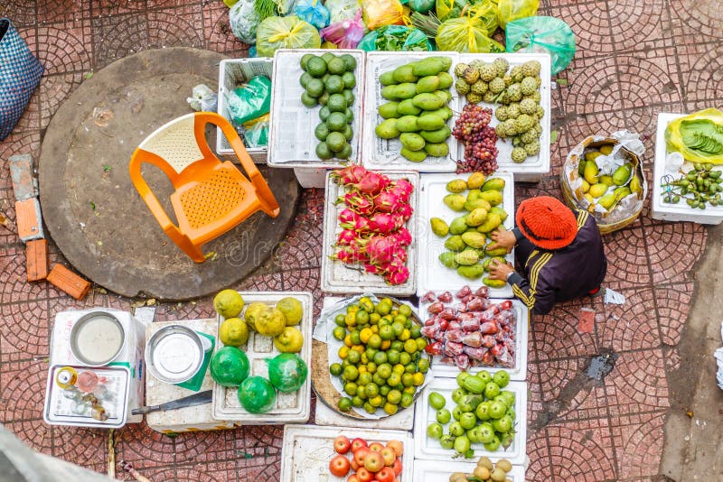 Vietnam street market lady seller stock photo Vietnam street market lady seller stock photo