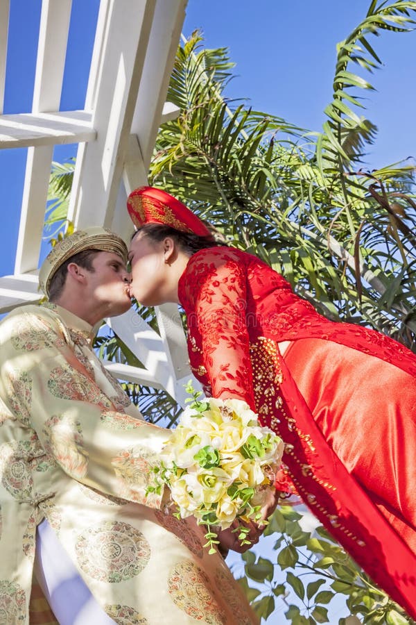 Vietnamese American Wedding Couple Kiss Stock Photo