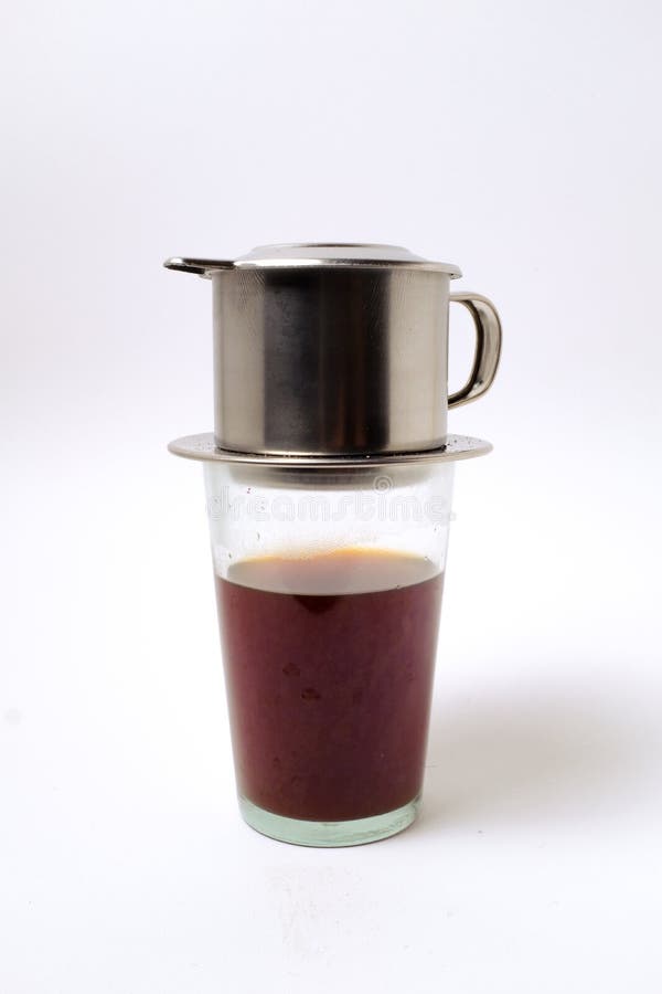 Vietnamese Coffee in Glass Cups and Traditional Metal Coffee Maker Phin