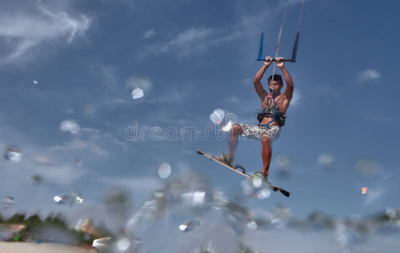 Vietnamese Kite Surfer Jumps with Kiteboard Stock Photo Image of