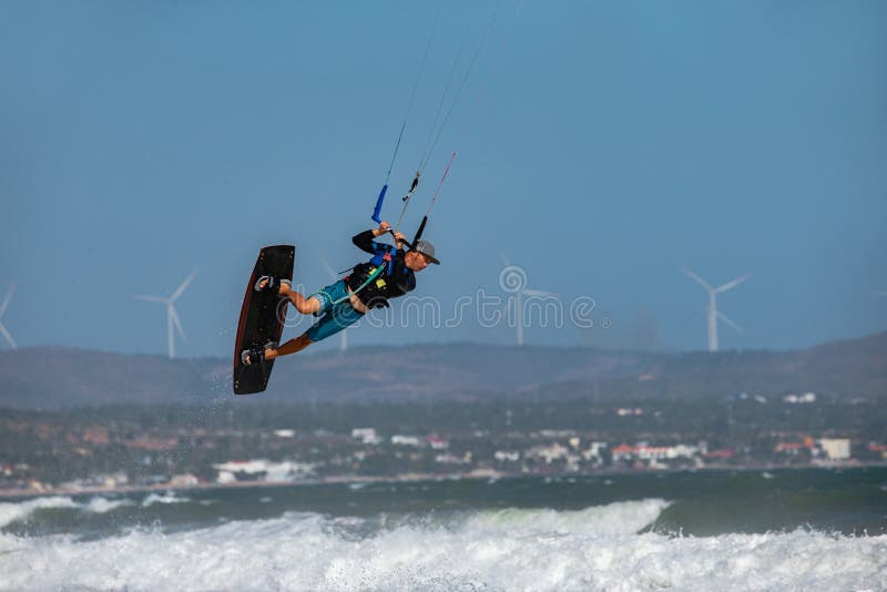 Vietnamese Kite Surfer Jumps with Kiteboard Stock Photo Image of