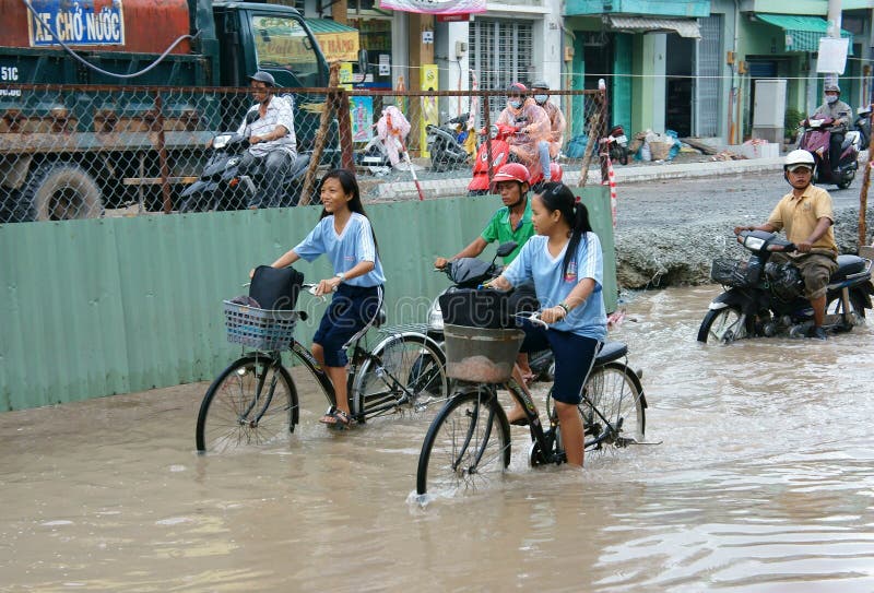 Vietnamese people, flooded water street royalty free stock photos Vietnamese people, flooded water street royalty free stock photos