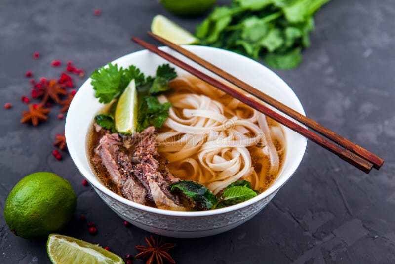 Pho Bo - Vietnamese fresh rice noodle soup with beef, herbs and chili. Vietnam`s national dish. Mint vietnamese stock images, royalty-free photos and pictures