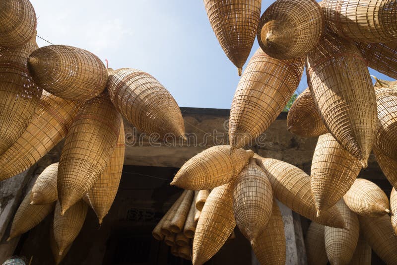 Vietnamese traditional bamboo fish trap hanging up for drying