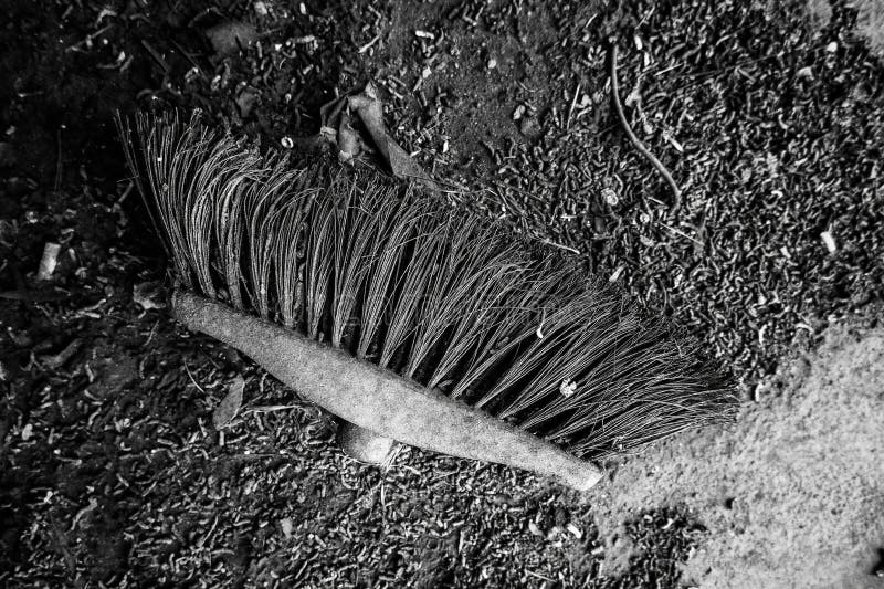 Detail of old and damaged broom for sweeping dirt. Detail of old and damaged broom for sweeping dirt