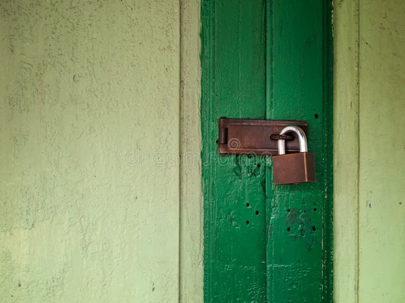 Old green door lock with old key. Old green door lock with old key