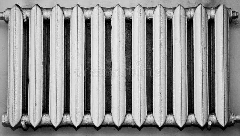 Old and dusty metal radiator, monochrome colour. Old and dusty metal radiator, monochrome colour.