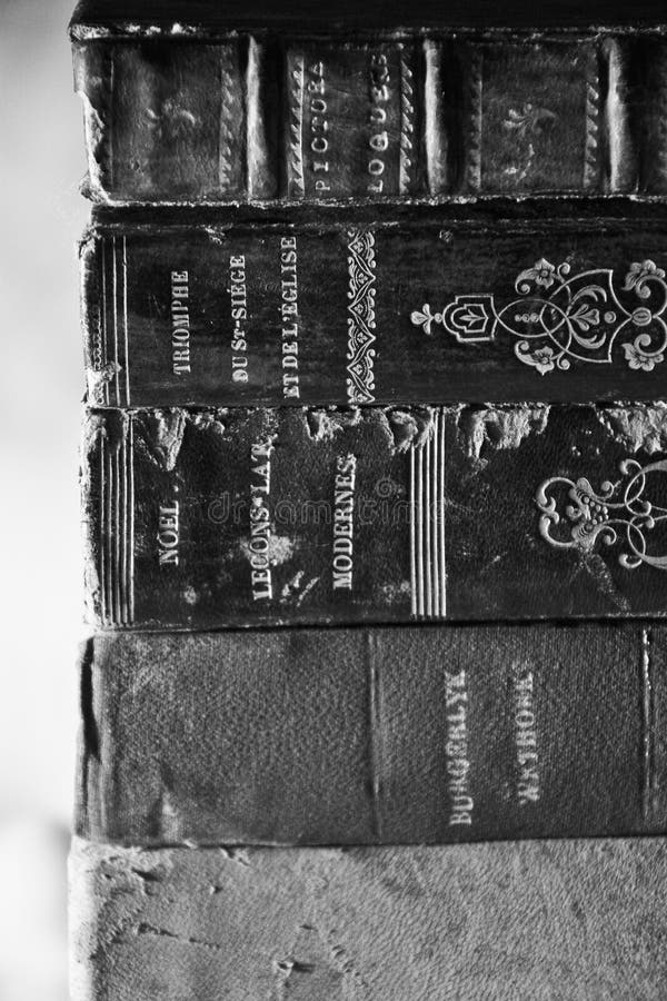 A black and white picture of old dusty books. A black and white picture of old dusty books