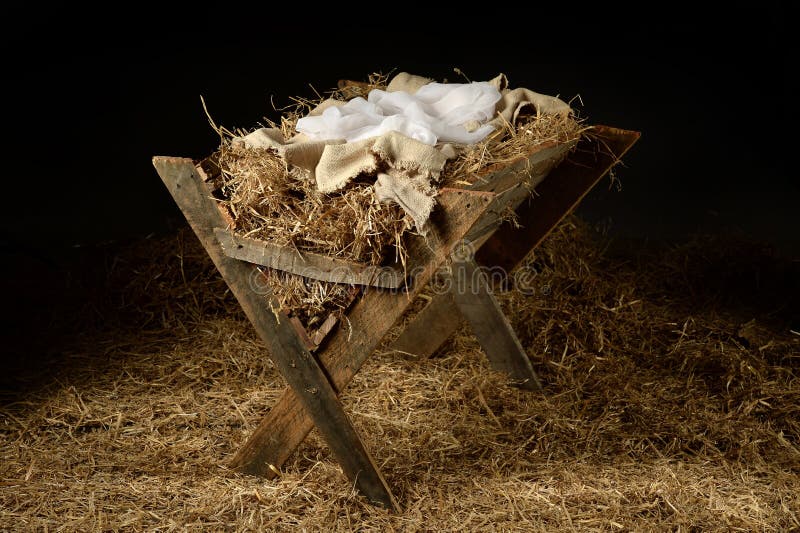 Old manger with old clothes as a symbol of waiting for Christmas. Old manger with old clothes as a symbol of waiting for Christmas